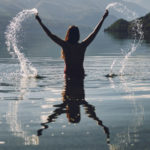 woman in lake splashing