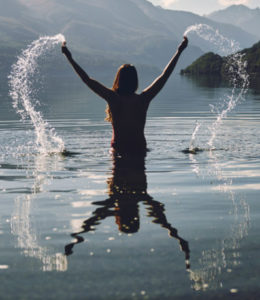 woman in lake splashing
